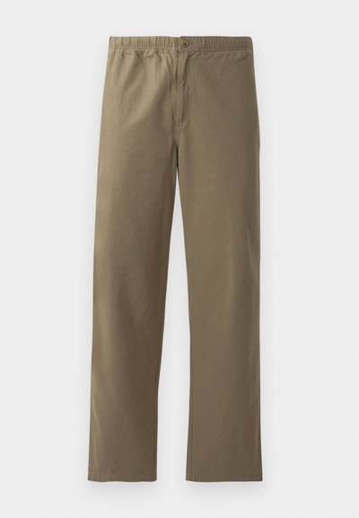 Kergest kangast khaki püksid. Omavad elastset vööd, nupuga sulgemist, sirgeid jalgu ja siledat tekstuuri.