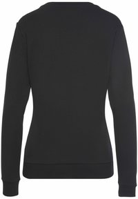 Sweatshirt noir à manches longues avec un col rond, poignets et ourlet côtelés. Texture douce et design simple, sans logos ni motifs visibles.