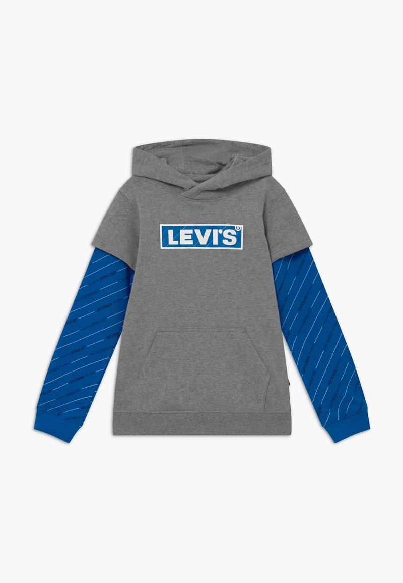 Hoodie gris à manches courtes avec manches longues bleues attachées présentant des rayures diagonales et le logo "Levi's" en bleu et blanc sur la poitrine.