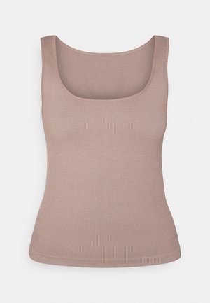 Ribota bez piedurknēm, maigi bēšā krāsā, ar kvadrātveida dekoltē. Materiāls ir gluds un cieši pieguļošs.