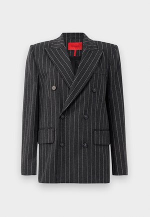 Blazer doppiopetto in tessuto di lana grigio scuro con righe bianche. Caratterizzato da revers a punta, due tasche frontali e chiusura a bottoni. Etichetta rossa con marchio all'interno.