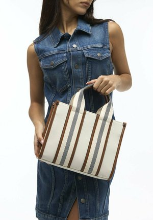 Canvas tote bag with brown leather accents, featuring vertical navy stripes on a cream background. Compact rectangular shape, dual handles.