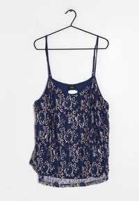 Marineblå linne med en vacker spetsöverdrag som har blommönster i ljusbeige. Justerbara spaghettiband och rundad nederkant.