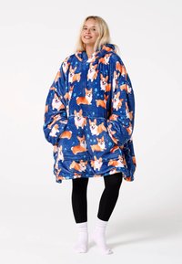 Modrá oversize mikina z fleecu s potlačou korgiho. Má veľkú kapucňu, priestranné rukávy a predné vrecko. Mäkká, pohodlná textúra.