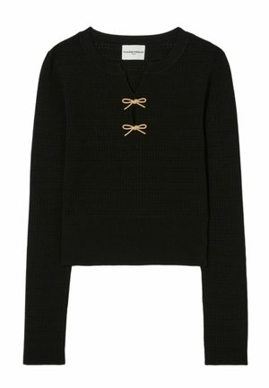 Pull en maille noir avec un col rond, des manches longues et deux accents en forme de nœud doré au centre. Tissu texturé avec une coupe courte.