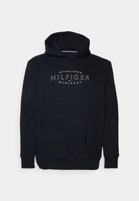 Felpa nera con cappuccio e tasca frontale, logo ricamato con la scritta "ESTABLISHED HILFIGER MCMLXXXV" in bianco, con polsini e orlo a costine.
