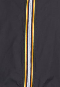 Black jacket with a central zipper featuring multicolored stripes in yellow, orange, navy, and white; smooth texture, lightweight material.