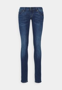 Jeans ajustados de color azul, hechos de denim, que cuentan con un clásico diseño de 5 bolsillos, cierre delantero con botón y un sutil desgaste en los muslos.