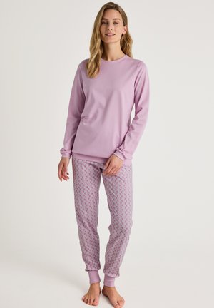 Lilac long-sleeve pajama top paired with patterned pajama pants featuring a floral design in pastel colors. Soft fabric with ribbed cuffs.