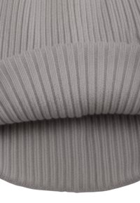 Gray knitted fabric with vertical ribbing and a rolled hem, showing a soft texture and even stitching.