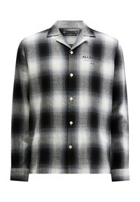 Camisa de cuadros en blanco y negro con cuello, que presenta una textura suave, cinco botones y una marca en la parte delantera.