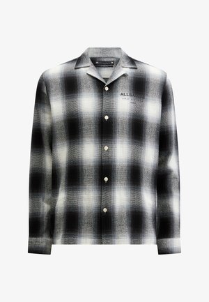 Camicia a quadri bianca e nera con colletto, caratterizzata da una consistenza morbida, cinque bottoni e un marchio sulla parte anteriore.