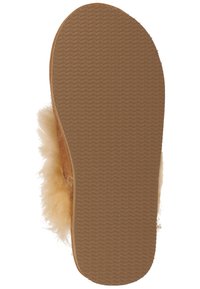 Brown slipper with a soft, fluffy upper and a textured rubber sole. The sole features a chevron pattern for grip and stability.