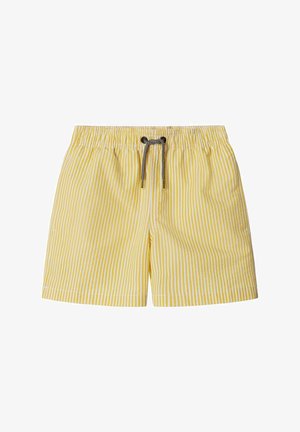 Pantaloncini a righe verticali gialle e bianche con una fascia elastica in vita e un laccio nero al centro davanti.