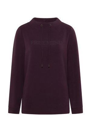 Fioletowa bluza z kapturem wykonana z miękkiego materiału, z troczkami i wytłoczonym tekstem "FREE MIND" z przodu. Długie rękawy z dopasowanymi mankietami.