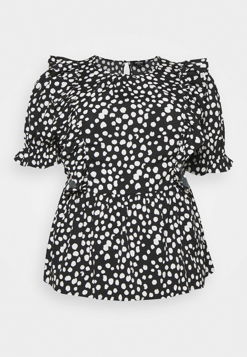 Blouse noire à pois blancs irréguliers, manches courtes bouffantes, bordure à volants sur les épaules et les manches, et détail taille évasée peplum.