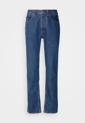 Kék farmernadrág egyenes szabással, öt zsebes kialakítással és világos varrással. Cipzáras és elöl gombos záródás jellemzi.