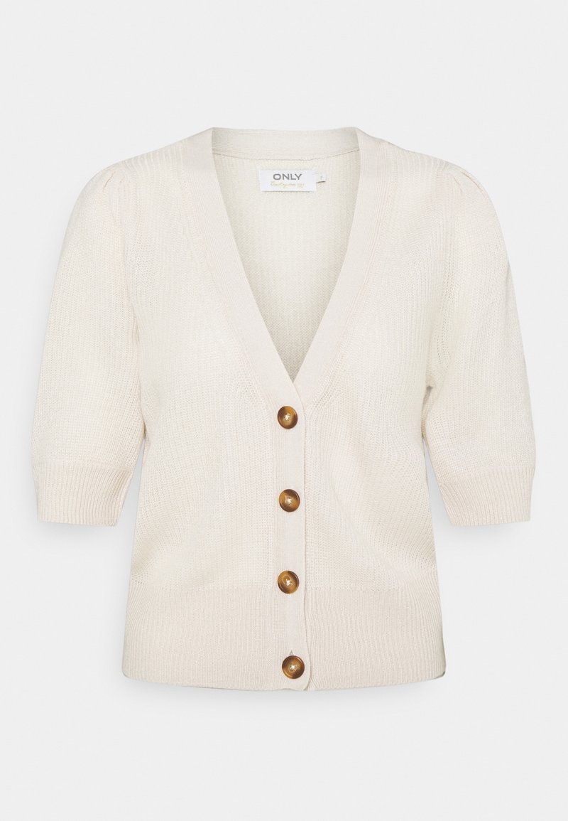 Krämfärgad stickad cardigan med V-ringning, korta puffärmar och fyra bruna knappar framtill. Strukturerad tyg med ribbade ärmslut.