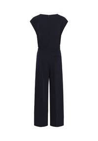 Salopetă de marină cu mâneci scurte, pantaloni largi, fermoar la spate și un mic buzunar lateral, confecționată dintr-un material neted pentru un aspect elegant.