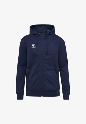 Modra zip-up kapa s dvema sprednjima žepoma, nastavljivim pokrovom s vrvico in logotipom na levi prsi. Mehka bombažna mešanica.