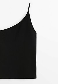 Camisola nera con spalline sottili e regolabili, realizzata in un tessuto morbido e leggero. Presenta una forma semplice e slanciata.