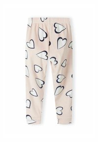 Pantalones de felpa rosa claro con cinturilla elástica, decorados con corazones grandes y pequeños en contorno negro y blanco dispersos.