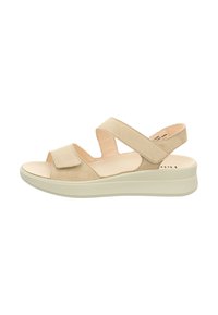 Beige Wildledersandale mit zwei verstellbaren Riemen, offenes Zehendesign und einer weißen gepolsterten Plattformsohle. Keine sichtbaren Beschläge.