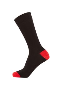 Black sock with ribbed top and red accents at the toe and heel. Crafted from soft material, displaying a simple and classic design.