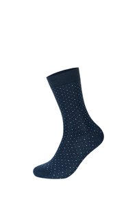 Calzino in cotone blu navy con un motivo a pois azzurri, dotato di un orlo a coste e una superficie liscia.