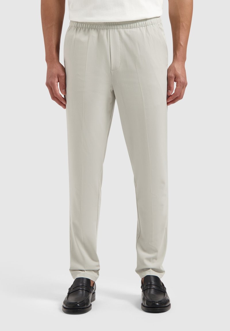Light gray, elastic waistband trousers with a relaxed fit and smooth texture, featuring side pockets and a straight leg design.