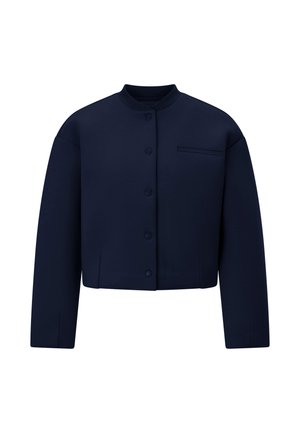 Tamsiai mėlynas trumpas švarkelis su apvalia iškirpte, užsegamas sagomis ir mažomis kišenėlėmis krūtinės srityje. Pagamintas iš lygaus audinio, su laisvomis rankovėmis.