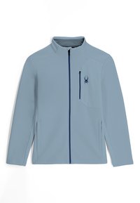 Lichtblauwe zip-up jack met ribbelstructuur, een klein borstzakje en een marineblauwe rits. Bevat een spinnenlogo aan de linkerkant.