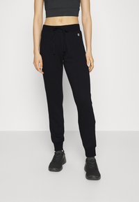 Champion - BASIC CUFF PANTS - Treniņtērpa apakšdaļas - black Miniatūras attēls 1