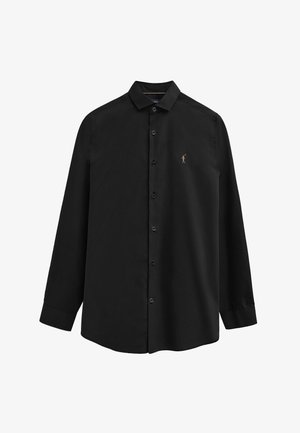 Zwart overhemd met lange mouwen, knopen en een kraag, met een klein geborduurd polo-spelerlogo op de linkerborst.