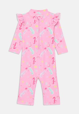 T-shirt de protection à manches courtes rose avec fermeture éclair sur le devant, accents en volants et un motif de hippocampe coloré avec des éléments aquatiques. Fabriqué en tissu extensible.