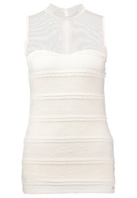 Top bianco senza maniche con collo alto, caratterizzato da righe orizzontali testurizzate e bordo in pizzo. Realizzato in tessuto leggero, con chiusura a zip sul retro.