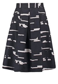 Gonna nera con motivo astratto bianco, design plissettato, lunghezza al ginocchio, tessuto strutturato, dotata di vita elastica per una vestibilità comoda.