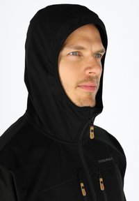 Black hooded jacket with a smooth texture, featuring zippers and leather pulls. Design includes a high collar and fitted hood.