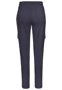 Navy blue jogger pants made of smooth fabric. Features a drawstring waistband and two side cargo pockets. Straight cut, tapered design.