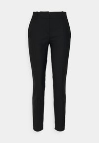 Pantalons noirs ajustés en tissu lisse, dotés d'une taille haute, de plis discrets et d'une coupe slim jusqu'aux chevilles.