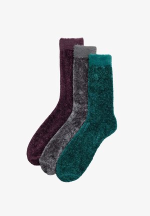 Conjunto de tres calcetines cómodos en púrpura oscuro, gris y tono teal. Hechos de una tela suave y esponjosa con una textura ligeramente peluda y colores sólidos.