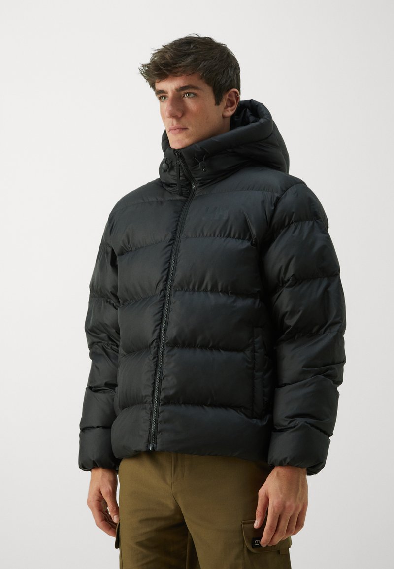 Black puffer jacket with a hood, featuring quilted segments and a front zipper. The fabric appears smooth and water-resistant.