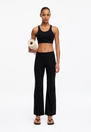 ARKET, ARKET CROPPED FLARED LEGGINGS - Püksid - black