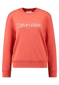 Felpa color corallo con maniche lunghe, scollo rotondo e logo "Calvin Klein" bianco sul davanti; realizzata in tessuto morbido e strutturato.