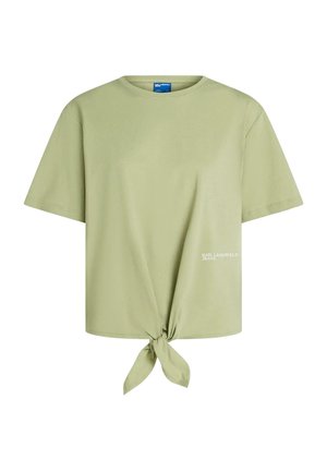 T-shirt vert clair à manches courtes avec un nœud à l'avant et petit logo blanc "Karl Lagerfeld Jeans" en bas à droite.