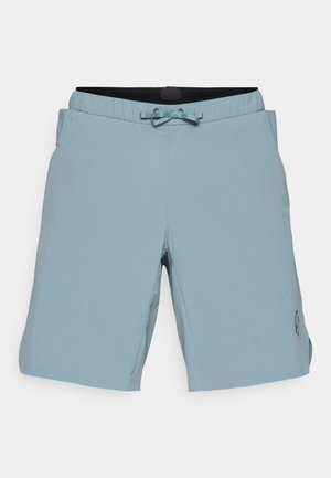 Light blue swim shorts with an elastic waistband, drawstring, and side pockets. Features a small logo on the lower right leg.