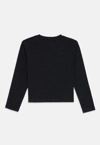 Black long-sleeve top made of cotton, featuring a crew neck and a cropped design. The fabric has a smooth texture with no visible patterns.