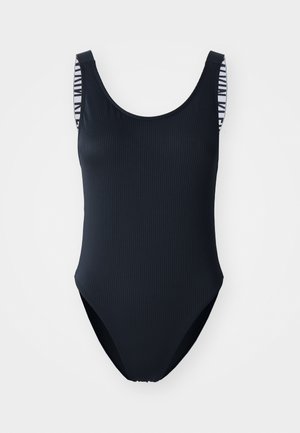 Črn rebrast enodelni kopalke z širokimi naramnicami, ki ima na notranji strani črtasto zasnovo. Visoko izrezane noge in okrogel ovratnik.