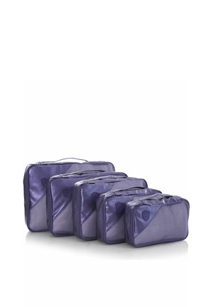 Set of five purple nylon packing cubes in small to large sizes, arranged in a row on a white background.
