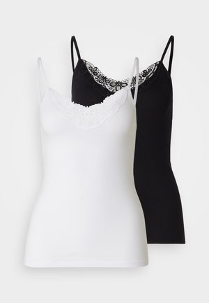 Two camisole tops in white and black. Both feature thin straps and a decorative lace neckline. Made of soft, stretchy fabric.